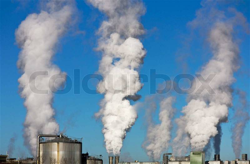 Smoking chimney of an industrial company. Pollution and waste gases, stock photo