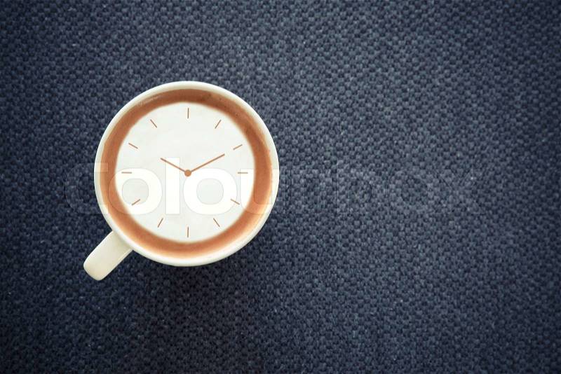 Coffee time , watch drawing on latte art coffee cup , stock photo