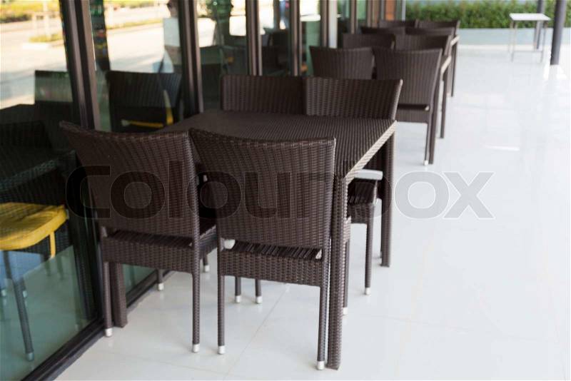 Chairs and tables in a restaurant Black chairs and tables in the restaurant for customers, stock photo