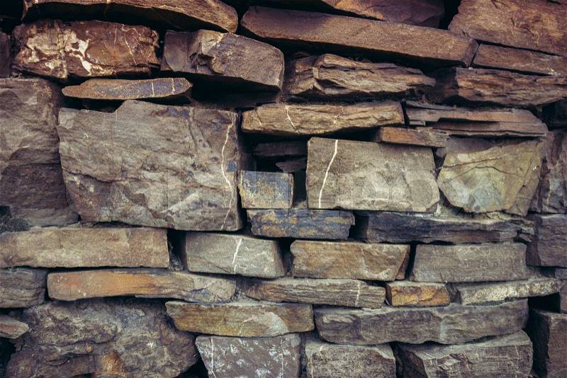 Old stone wall. pattern of decorative slate stone wall surface. Abstract background of stone wall texture, stock photo