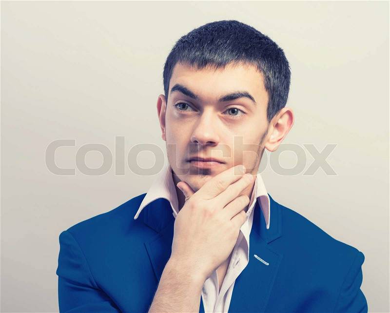 Young guy deliberates a decision. , stock photo