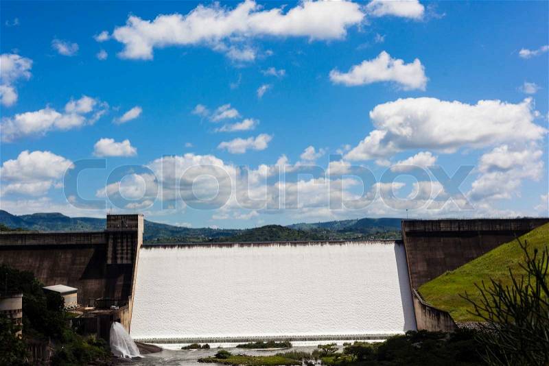 Inanda Dam fill to capacity and water flowing over the high wall, stock photo