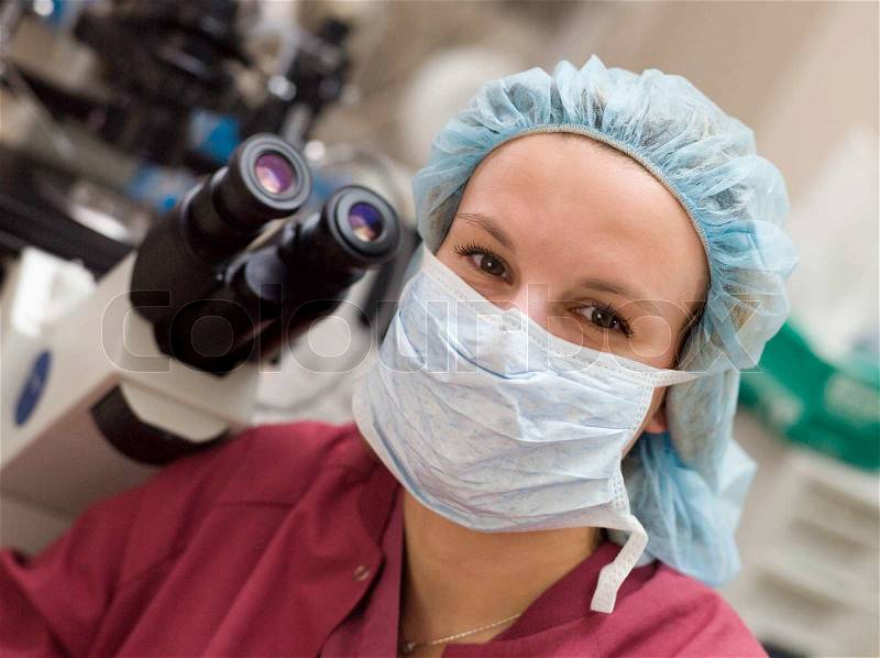 Portrait of embryologist wearing mask in laboratory, stock photo