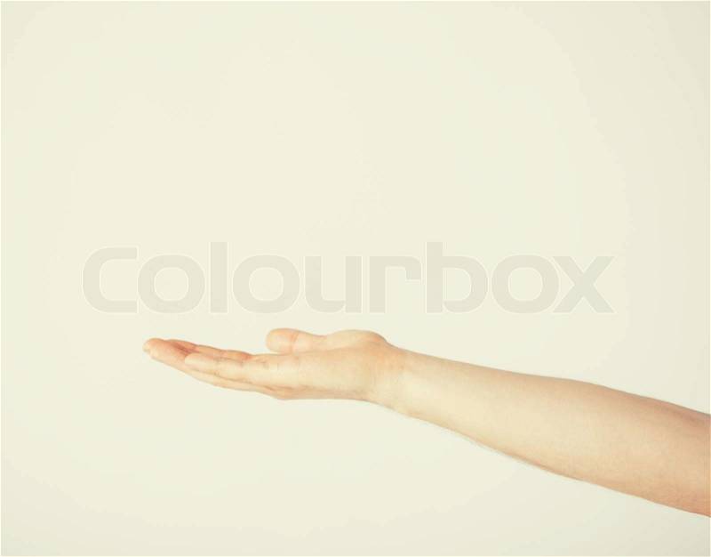 Close up of mans hand showing something, stock photo