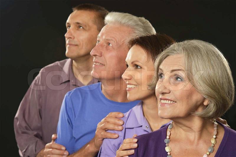 Cute family portrait with senior parents, stock photo