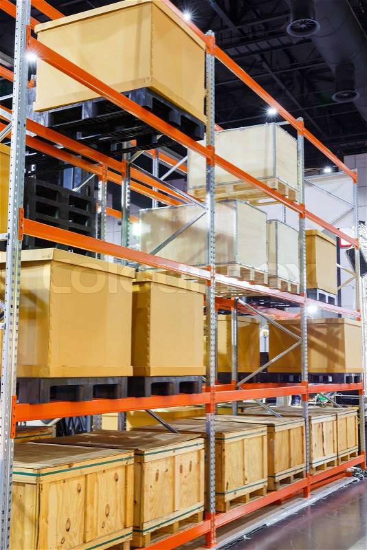 Close up paper and wooden cargo box on steel shelf system in warehouse, stock photo