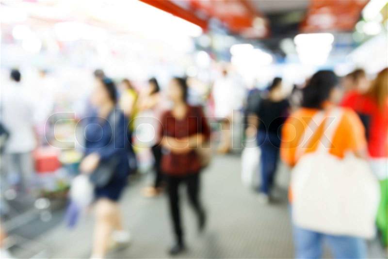 Abstract blurred people walking in shopping center, stock photo
