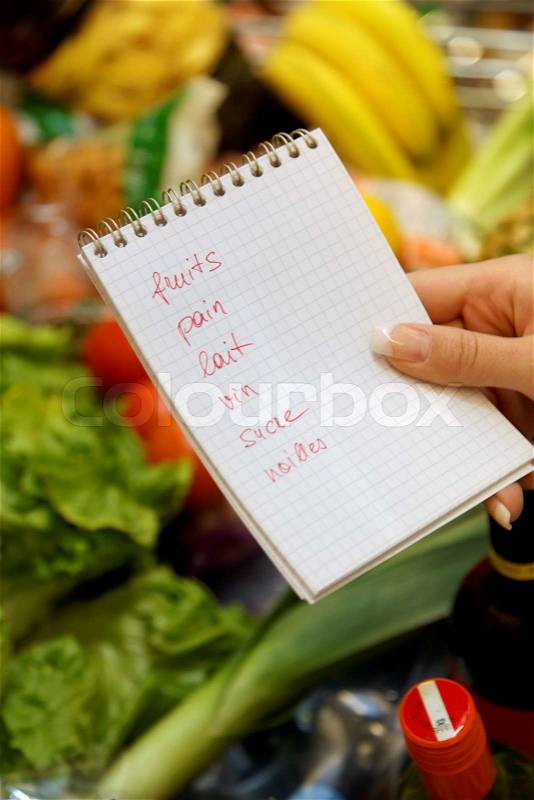 French shopping list in a supermarket shopping cart, stock photo