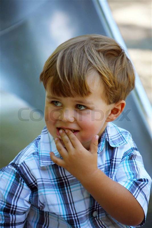 A little boy thinks, stock photo