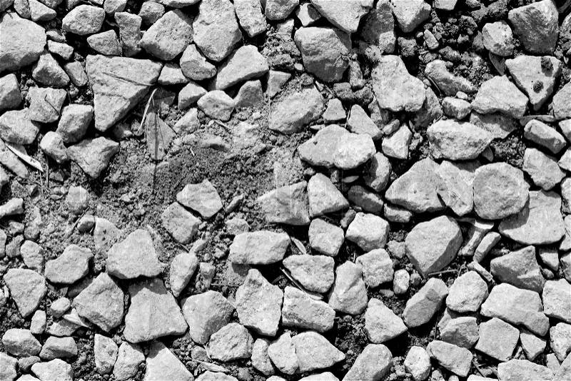 Black granite stones pebbles white background, stock photo