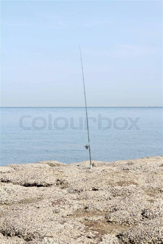 Sea fishing in sea in summer among reefs, stock photo