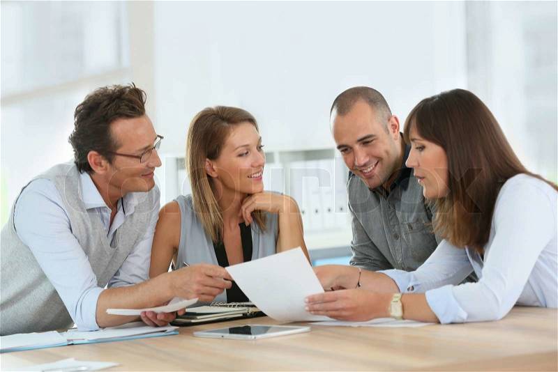 Group of business people meeting in office, stock photo