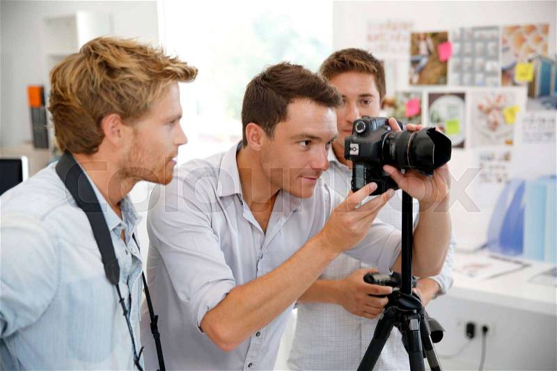 Photographer with students in training class, stock photo