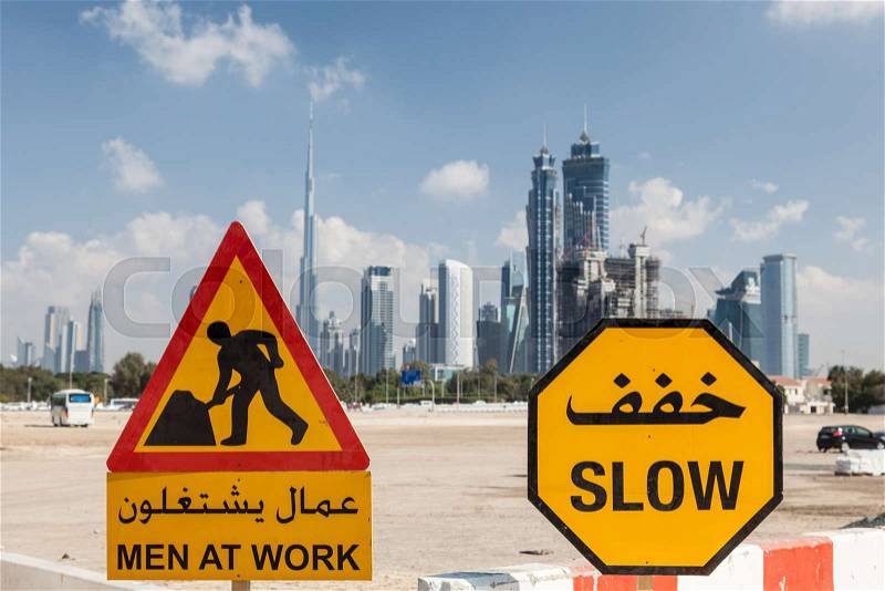 Men At Work sign in the city of Dubai, United Arab Emirates, stock photo