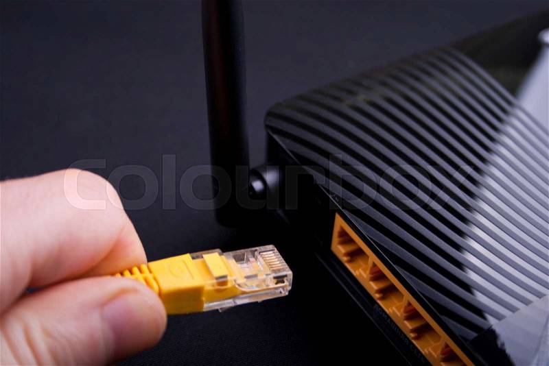 Connection router with lan cable, close up, stock photo
