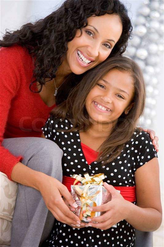 An african-american mother and her daughter celebrating Christmas day, stock photo