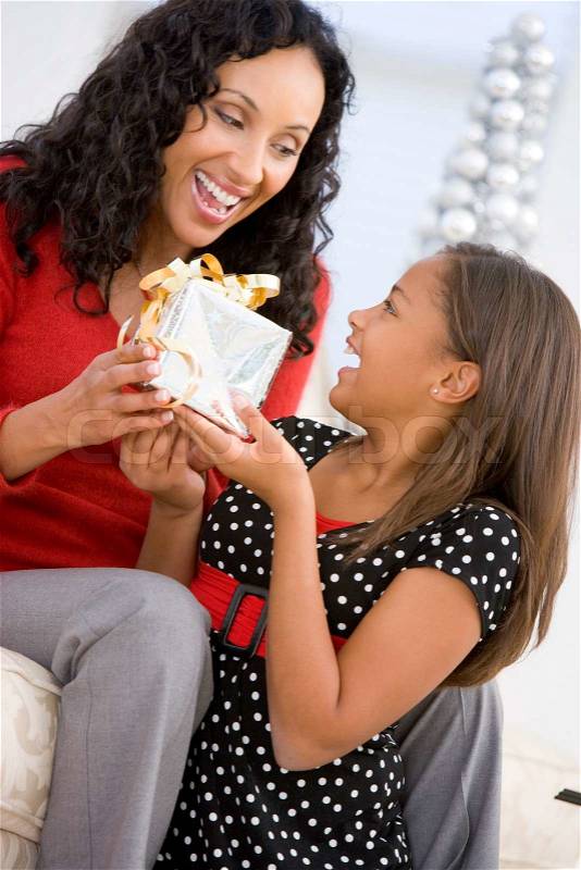 An african-american mother and her daughter celebrating Christmas day, stock photo
