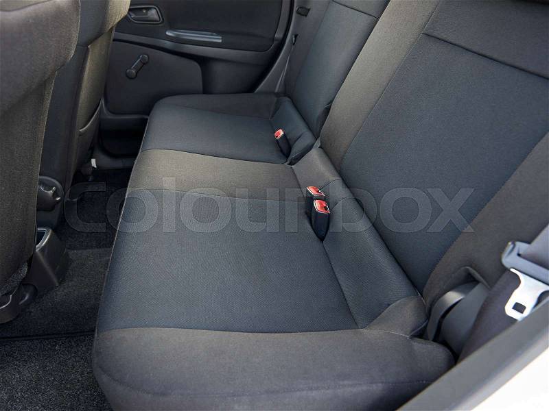 Black back seats of an used car seen from the side, stock photo