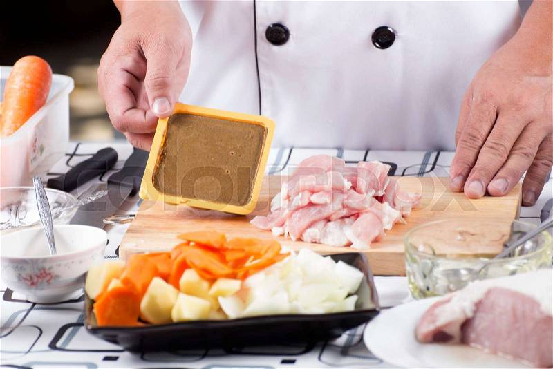 Chef present Japanese curry paste and ingredient / cooking Japanese pork curry concept , stock photo