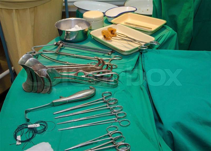 Surgeon and old surgical tools, stock photo