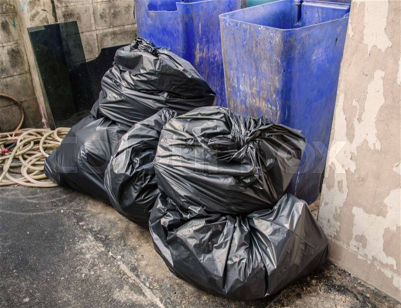 Big pile of garbage in black bags, stock photo