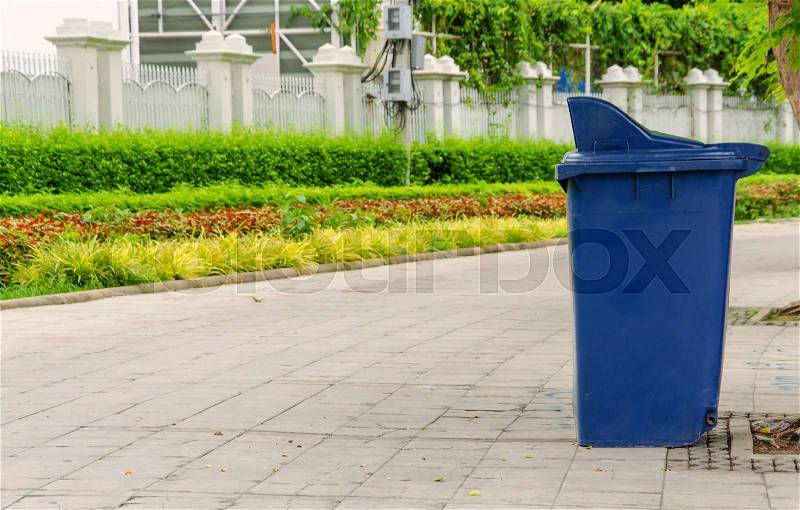 Trash cans in the park beside the walk way, stock photo