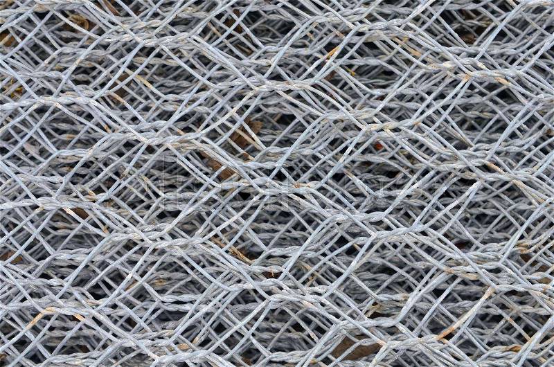 Steel iron raw wire fence texture in a warehouse, stock photo