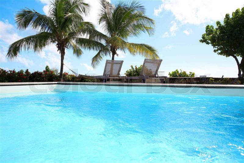 Private swimming pool in tropical area, stock photo