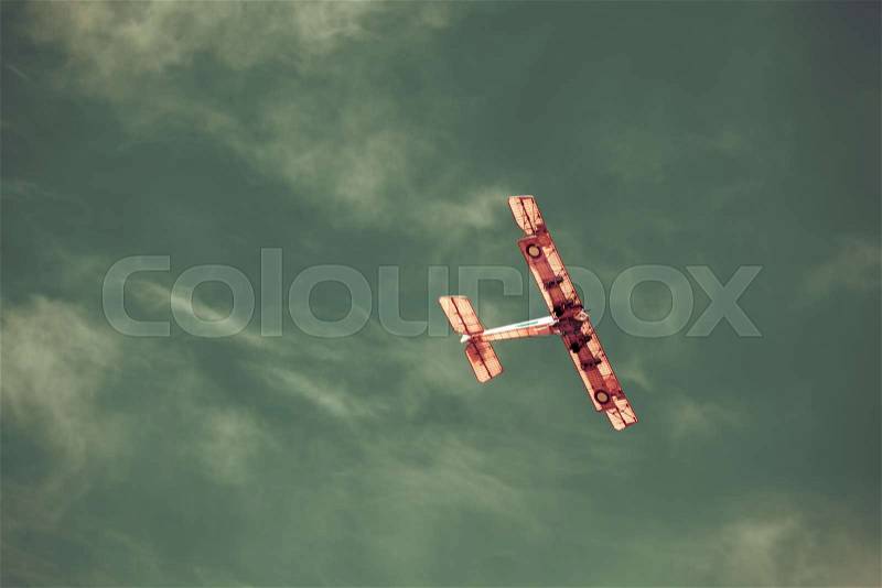 Old plane in sky, stock photo