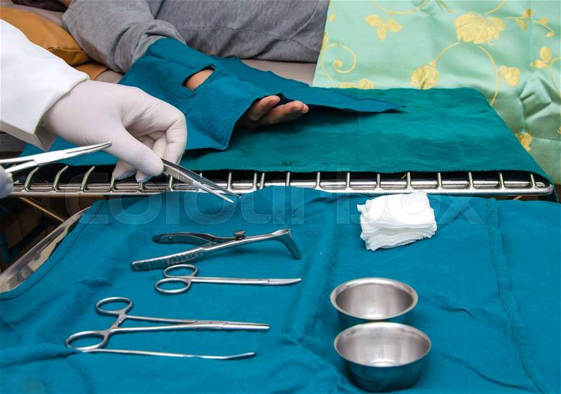Surgeon and Surgical instruments in operation, stock photo