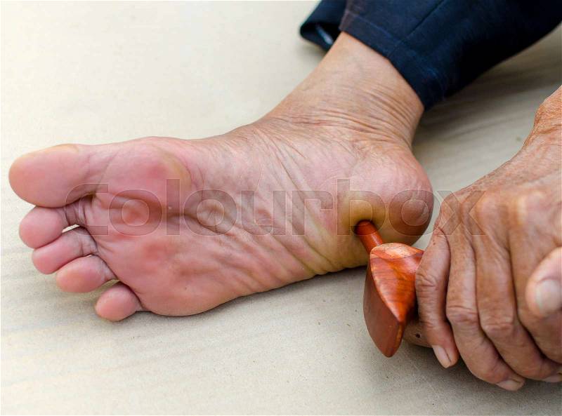 Reflexology foot massage, Spa treatment yourself, stock photo