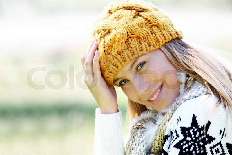 Portrait of blond woman in winter clothes and accessories, stock photo