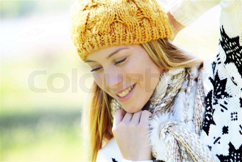 Portrait of blond woman in winter clothes and accessories, stock photo