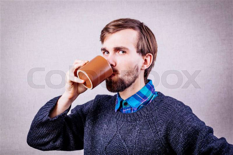 Men drinking coffee. Close-up of men drinking coffee outdoors, stock photo