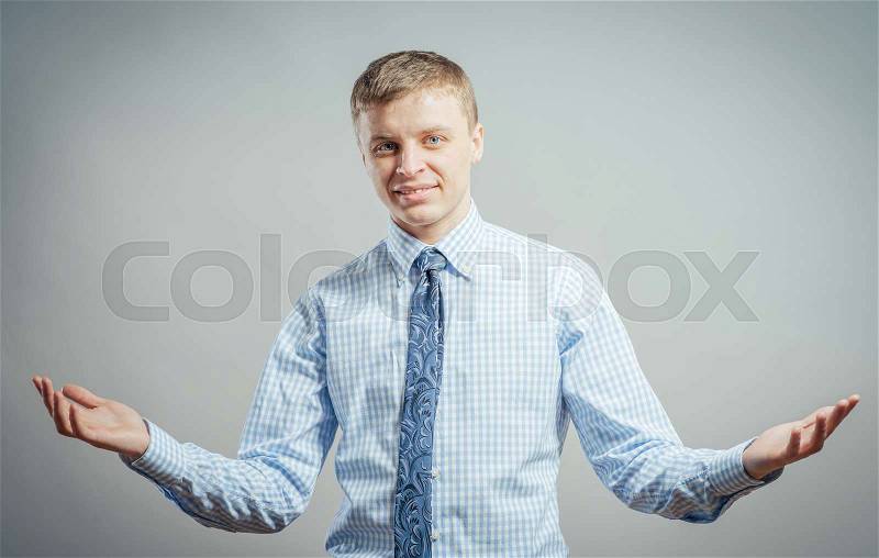 Young casual man with a smile on his face and his arms wide open, stock photo