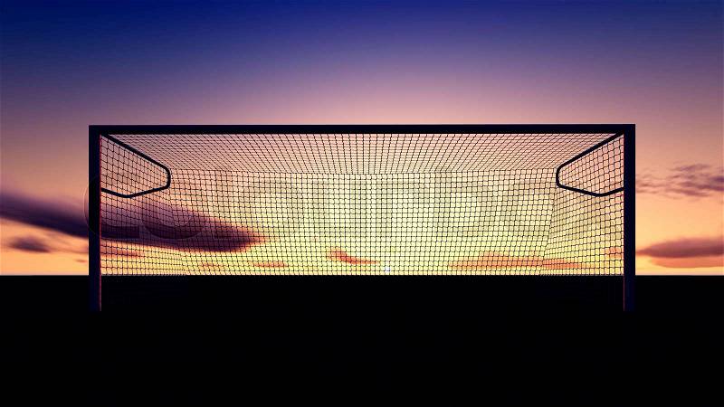 Soccer goal on the football field at sunset, stock photo