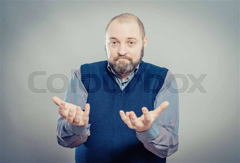 Young handsome man showing something, stock photo