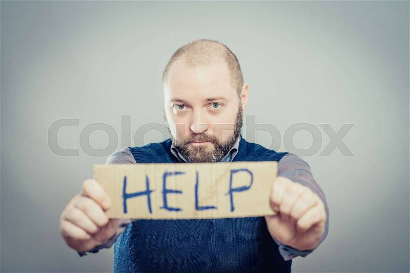 Man holding paper with help text, stock photo