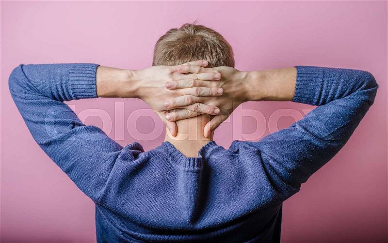 Back view picture of a young business man scratching his head , stock photo