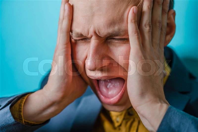 Angry business man screaming out loud at someone, portrait of young handsome businessman, concept of executive yelling, conversation problem communication crisis,anger,frustr ation, stock photo