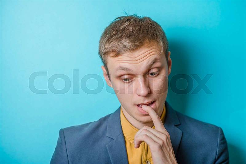 Young man. Gesture. does not know what to do, confusion, stock photo