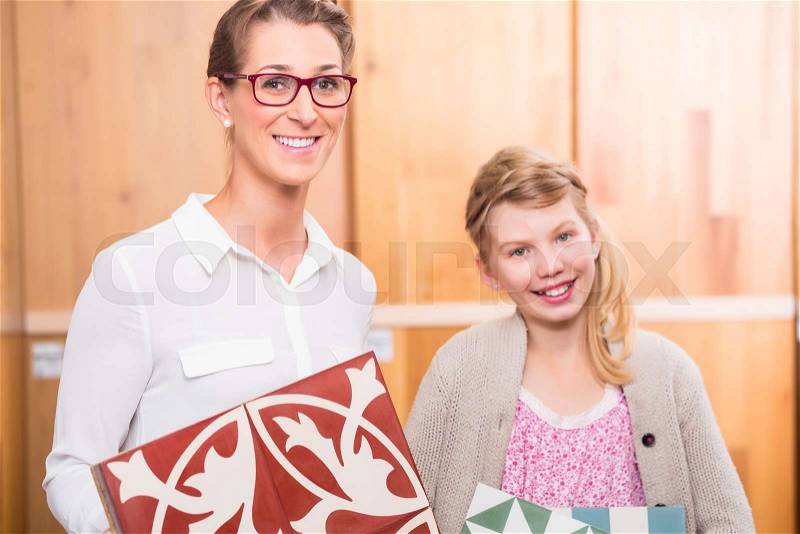 Family with cement floor tiles in home improvement store, stock photo