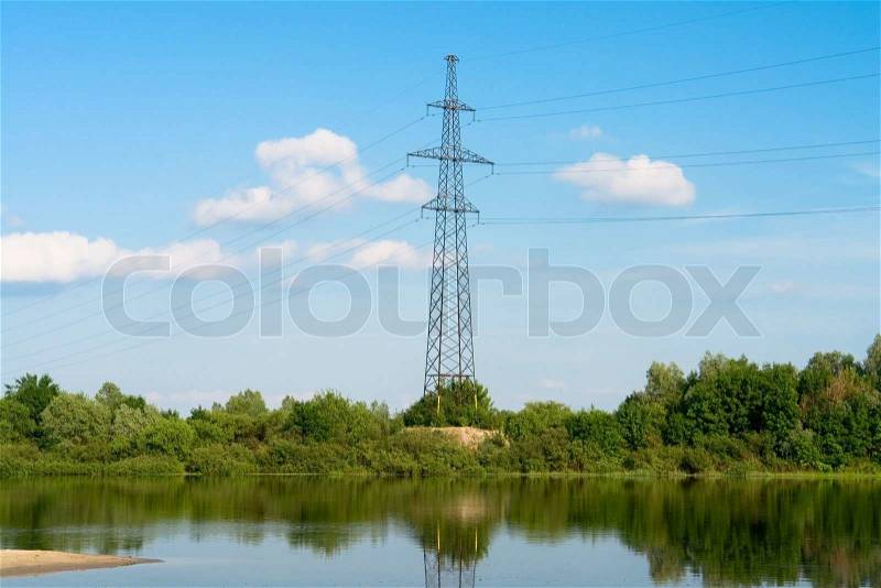 Electric power line near river, stock photo