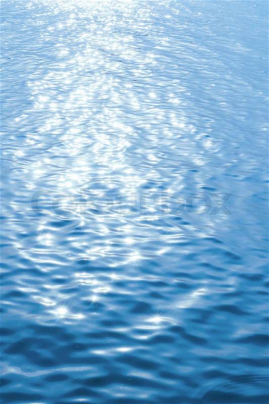 Shining water againts calm cold blue sunlight, stock photo