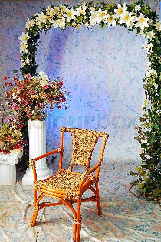 Wooden arm-chair and decorative pattern of flowers, stock photo