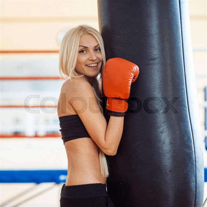 Boxing training blond woman sparring , stock photo