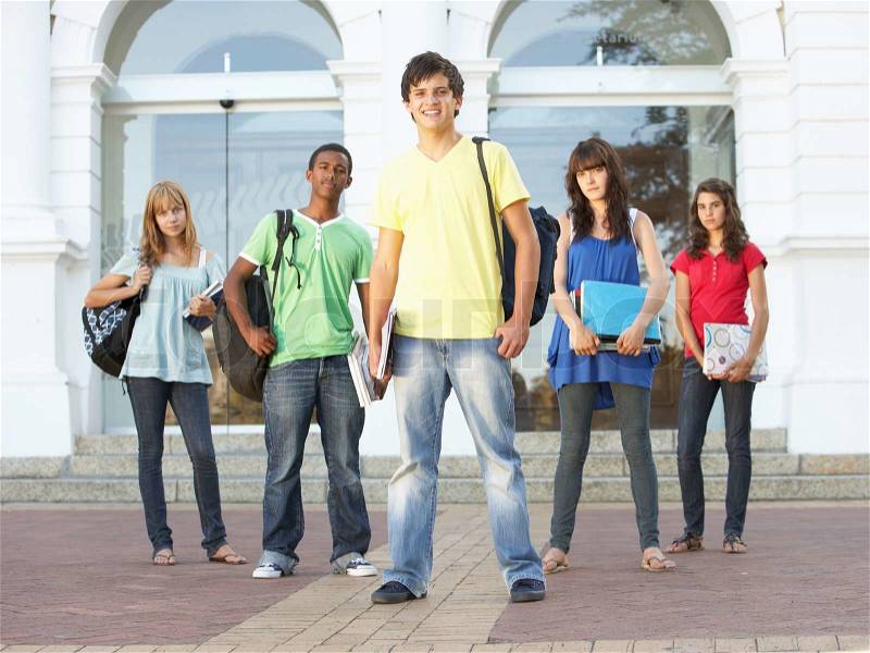 Group Of Teenage Students Standing Outside College Building, stock photo