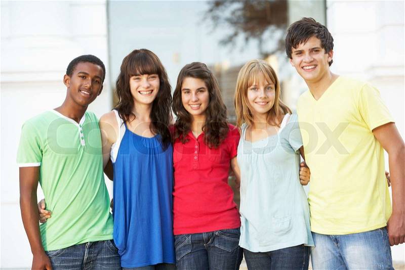 Group Of Teenage Students Standing Outside College Building, stock photo