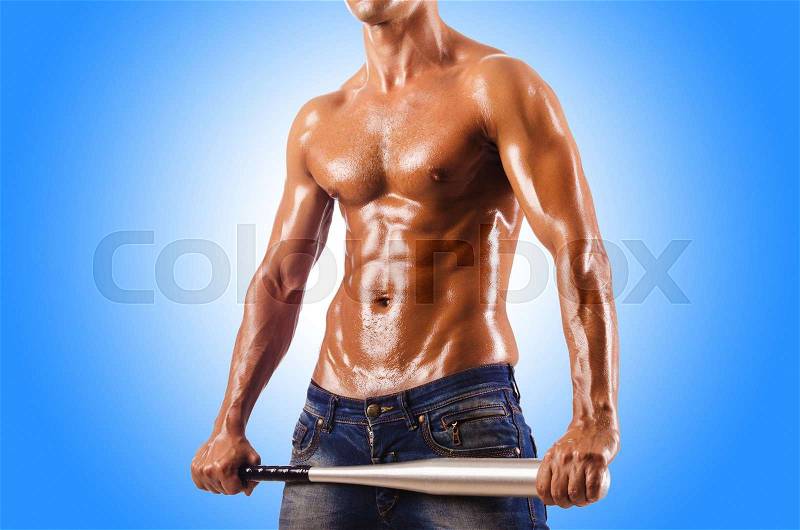 Muscular man with baseball bat, stock photo