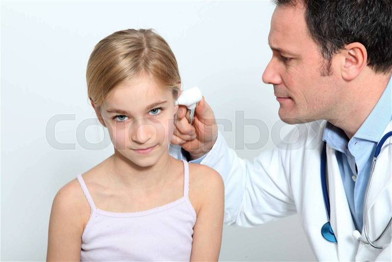 Doctor doing child medical check-up, stock photo